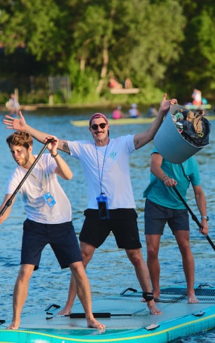 Three people on a SUP board