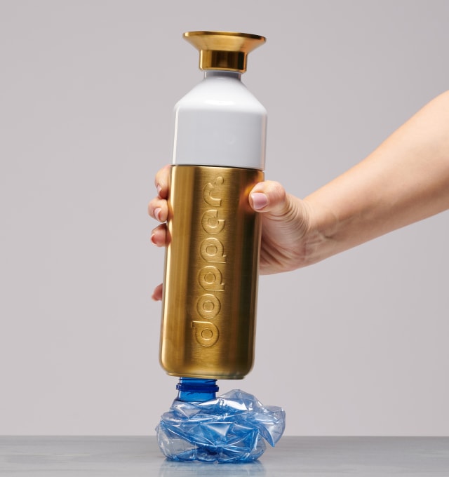 Golden Dopper Steel bottle crushing a SUP bottle